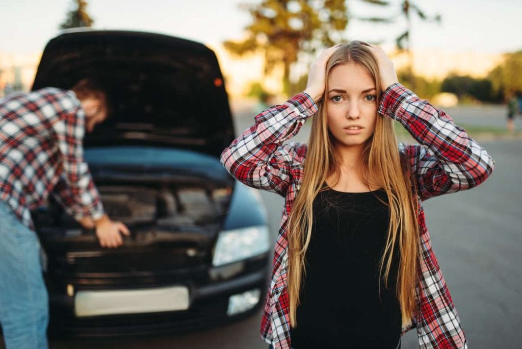 woman in front of minor fender bender for article titled How to Help Your Child after a Car Accident