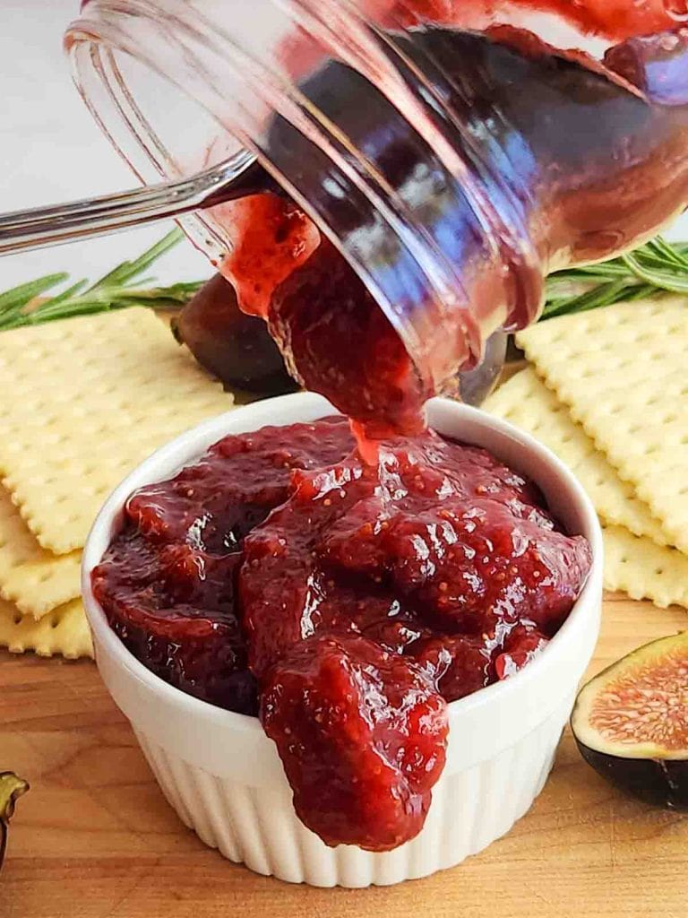 Pouring Fig Jam into a white bowl